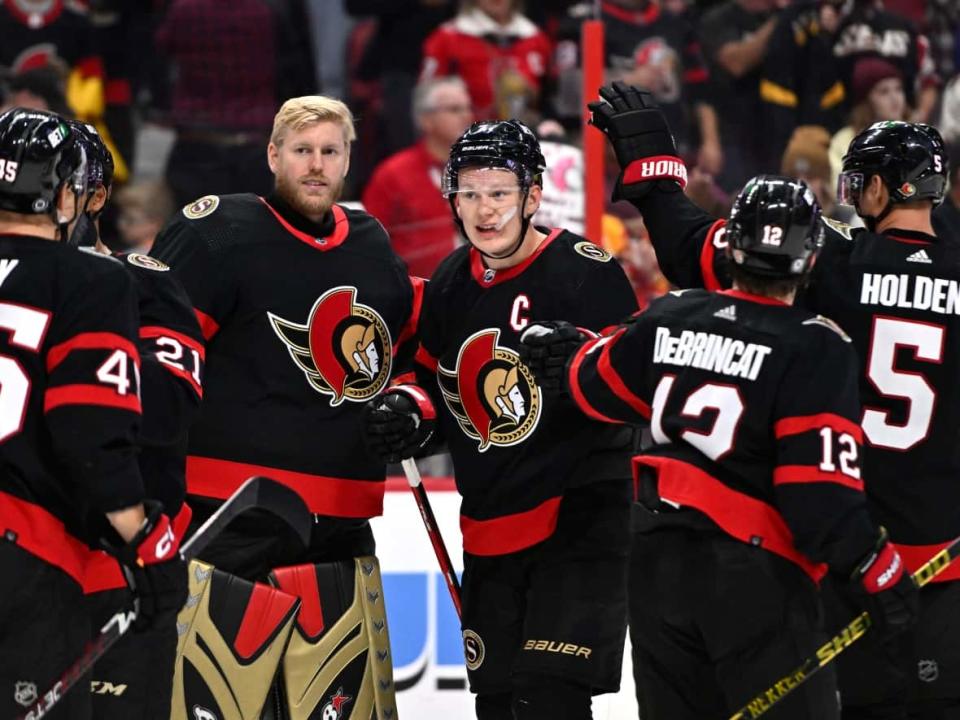 The Ottawa Senators celebrate after their win against the Boston Bruins last month. (Justin Tang/The Canadian Press - image credit)