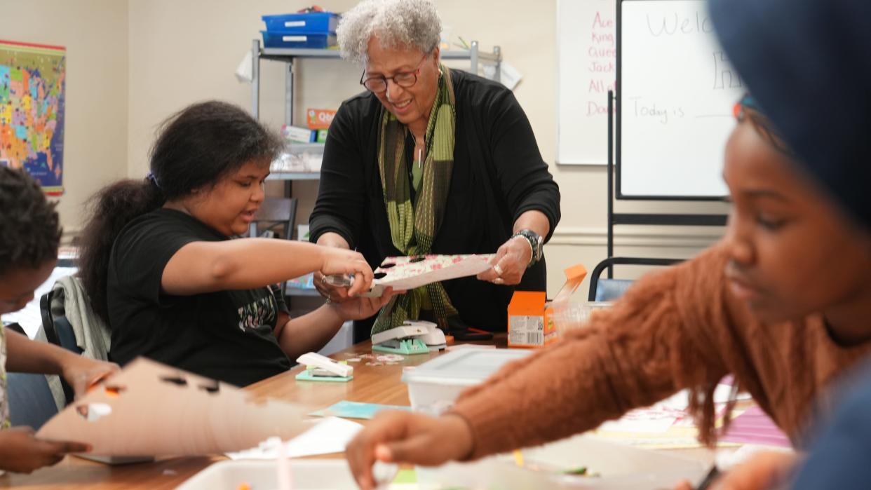 Janet George works with Karen Perry, 10, during the HYPE afterschool program for children whose parents are in an inpatient drug addiction recovery program. Perry's mom, Christina Perry, graduated the program but is still connected with Amethyst. George is the Family and Children's Team program director for Alvis and Amethyst, which operate HYPE.