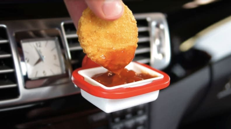 Credit:                      Saucemoto                                             Eating in your car just got a whole lot easier.