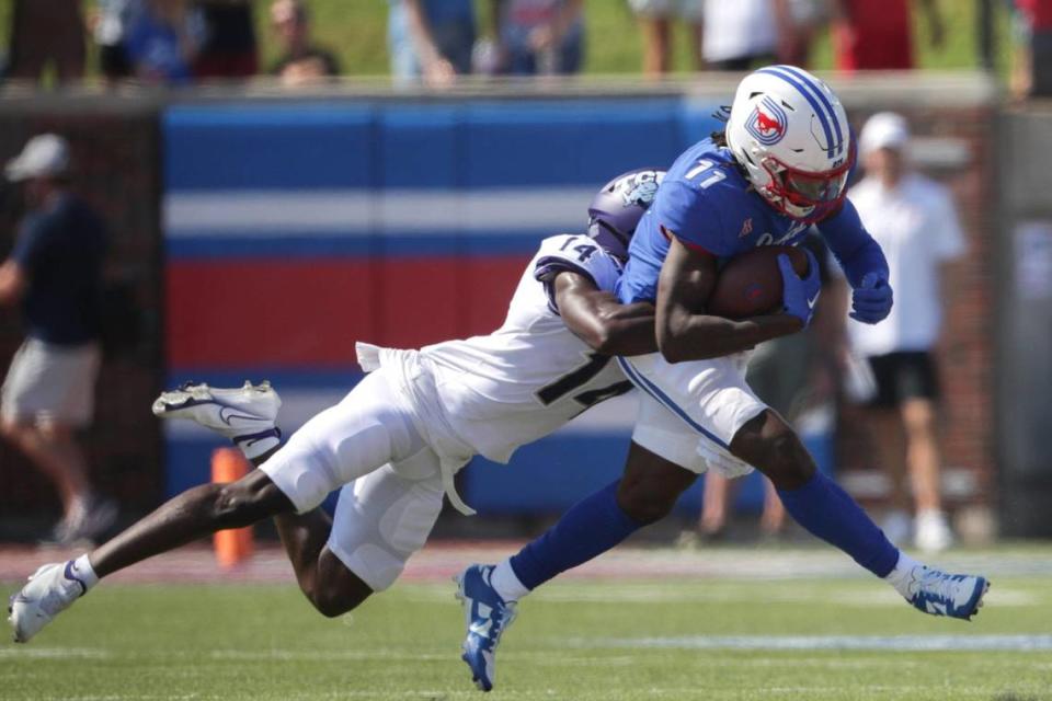 TCU safety Abe Camara tackles SMU wide receiver Rashee Rice on Saturday, Sept. 24, 2022, at the Gerald Ford Stadium in the Southern Methodist University in Dallas, Texas.