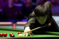 China's Zhao Xintong at the table during day thirteen of the Cazoo UK Championship at the York Barbican, england, Sunday, Dec. 5, 2021. (Richard Sellers/PA via AP)