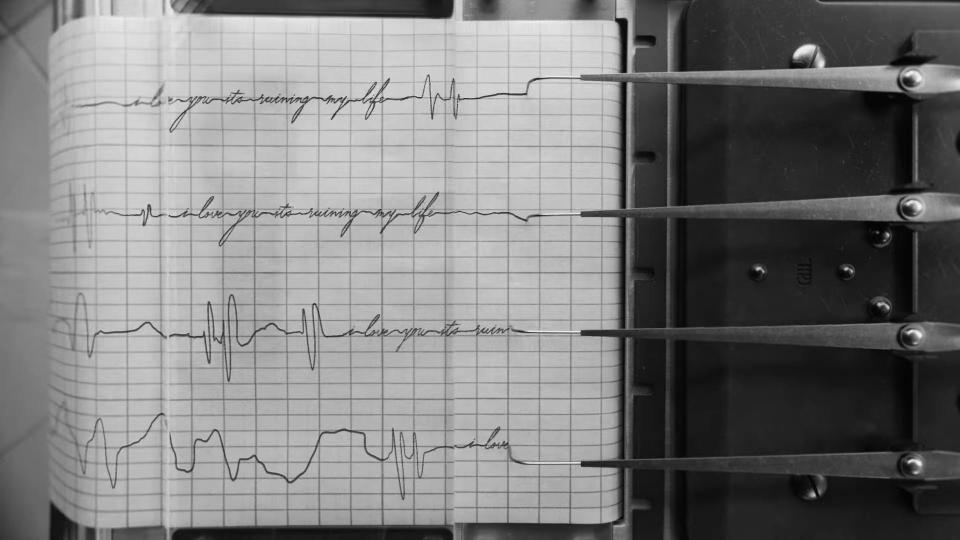 A scene of a polygraph in the music video for "Fortnight."