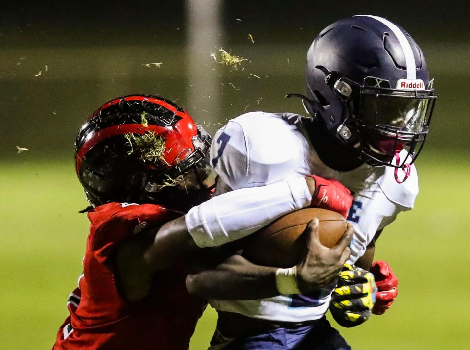 Red Lion's Tristan Grenardo tackles Lake Forest's Jaymeire Snell in the second half of the Lions' 28-6 win at Red Lion Christian Academy, Friday, Sept. 15, 2023.
