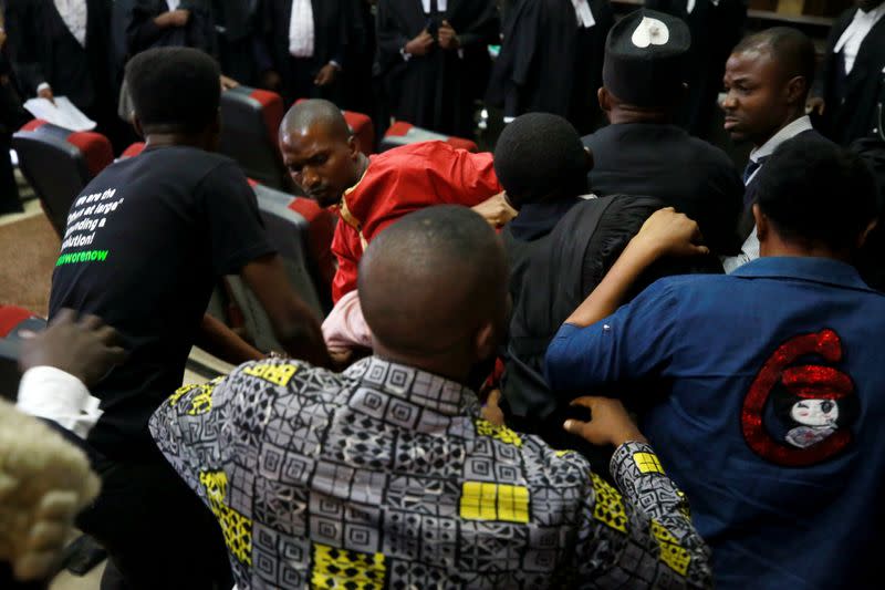 A fighting breaks out as security personnel attempt to re-arrest Nigerian activist Omoyele Sowore at a court in Abuja