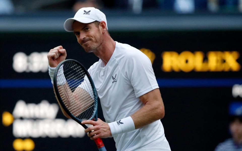 Britain's Andy Murray celebrates winning a game during his men's singles tennis match against Australia's James Duckworth on the first day of the 2022 Wimbledon Championships at The All England Tennis Club in Wimbledon, southwest London, on June 27, 2022.  - GETTY IMAGES