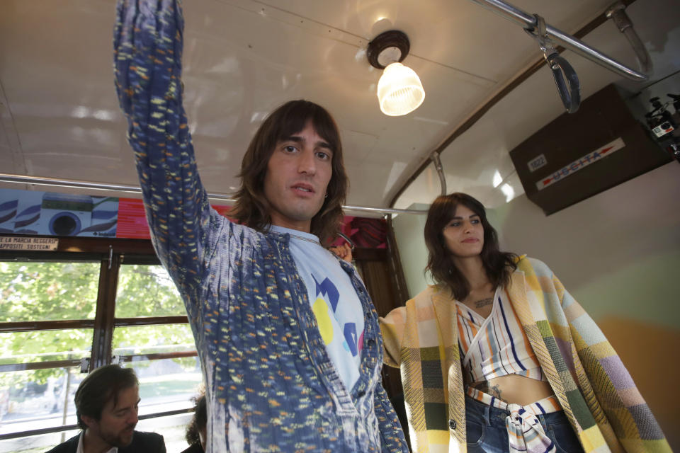 Models wear creations onboard a tram as part of the Missoni Spring-Summer 2020 collection, unveiled during the fashion week, in Milan, Italy, Thursday, Sept. 19, 2019. (AP Photo/Luca Bruno)