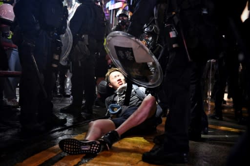 Police detain a protester at Causeway Bay in Hong Kong late on August 31, 2019