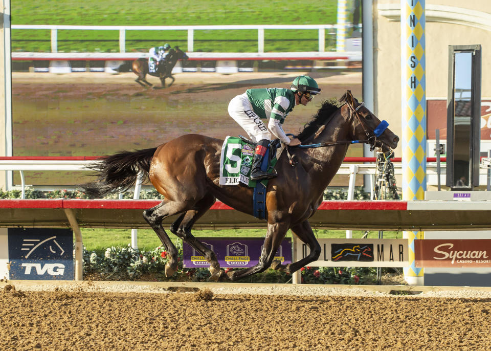 In this image provided by Benoit Photo, Flightline, with Flavien Prat aboard, wins the Grade I, $1,000,000 Pacific Classic horse race Saturday, Sept. 3, 2022, at Del Mar Thoroughbred Club in Del Mar, Calif. (Benoit Photo via AP)