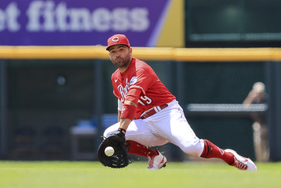 Cincinnati Reds' Joey Votto fields the ball hit by San Francisco Giants' Thairo Estrada for an out during the second inning of a baseball game in Cincinnati, Sunday, May 29, 2022. (AP Photo/Aaron Doster)