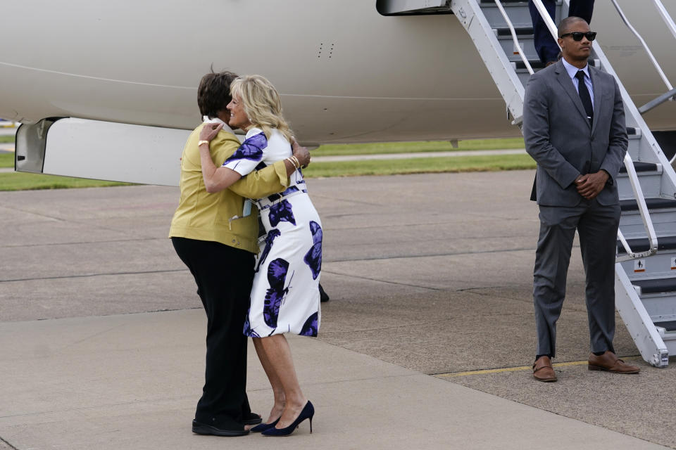 First lady Jill Biden hugs Rep. Eddie Bernice Johnson, D-Texas, as she arrives at Love Field Airport in Dallas, Tuesday, June 29, 2021. (AP Photo/Carolyn Kaster, Pool)