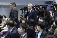 NATO Secretary-General Jens Stoltenberg, center, is escorted to the venue to meet students at Keio University in Tokyo, Wednesday, Feb. 1, 2023. (AP Photo/Eugene Hoshiko)