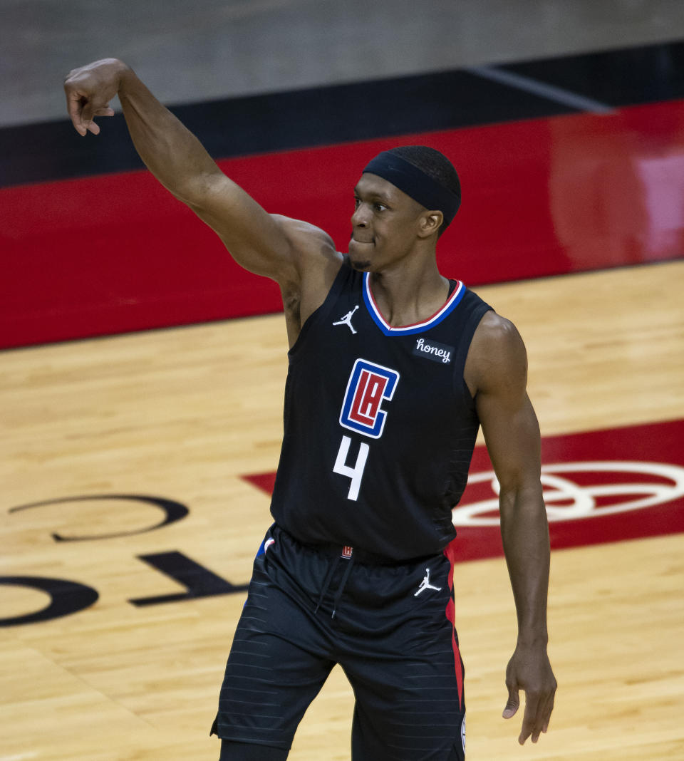 Los Angeles Clippers guard Rajon Rondo (4) watches a shot during the first quarter of an NBA game against the Houston Rockets on Friday, May 14, 2021, in Houston. (Mark Mulligan/Houston Chronicle via AP)