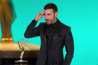 <p>accepted his first Emmy — which <a href="https://people.com/tv/2021-emmy-awards-brett-goldstein-wins-supporting-actor-comedy-series-ted-lasso/" rel="nofollow noopener" target="_blank" data-ylk="slk:he won for his supporting role as Roy Kent in;elm:context_link;itc:0;sec:content-canvas" class="link ">he won for his supporting role as Roy Kent in </a><em><a href="https://people.com/tv/2021-emmy-awards-brett-goldstein-wins-supporting-actor-comedy-series-ted-lasso/" rel="nofollow noopener" target="_blank" data-ylk="slk:Ted Lasso;elm:context_link;itc:0;sec:content-canvas" class="link ">Ted Lasso</a> </em>— with an expletive-filled speech Kent would approve of. </p>