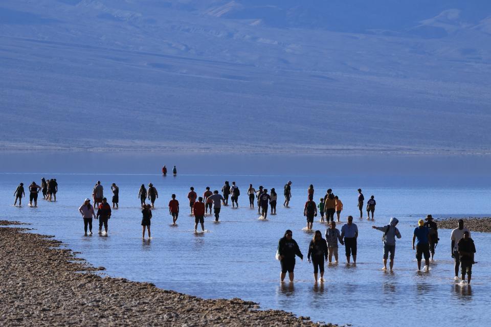 Tourists enjoy the rare opportunity to walk knee deep in briney water as they visit Badwater Basin, the normally driest place in the US, in Death Valley National Park, Inyo County, California on February 18. Badwater Basin, an endorheic basin in Death Valley National Park, was flooded by Hurricane Hilary in August 2023 and recent rains in California. It is the lowest point in North America, at 282 feet below sea level.