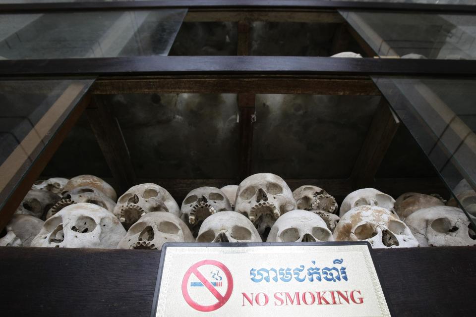 In this photo taken March 27, 2012, human skulls are displayed in the memorial stupa at the Choeung Ek killing field in Phnom Penh, Cambodia. The office of Cambodia's most celebrated filmmaker is filled with books on the Khmer Rouge - on his desk, on the walls, in the filing cabinets and in every corner of Rithy Panh's dimly lit office are memories of his country's national tragedy. In his latest movie, the 51-year-old filmmaker focuses for the first time on his personal story of loss and tormented survival. "The Missing Picture" won an award at last year's Cannes Film Festival and is up for Best Foreign Language Film at the Oscars this weekend, marking the first time a Cambodian film has been nominated for an Academy Award. (AP Photo/Heng Sinith)