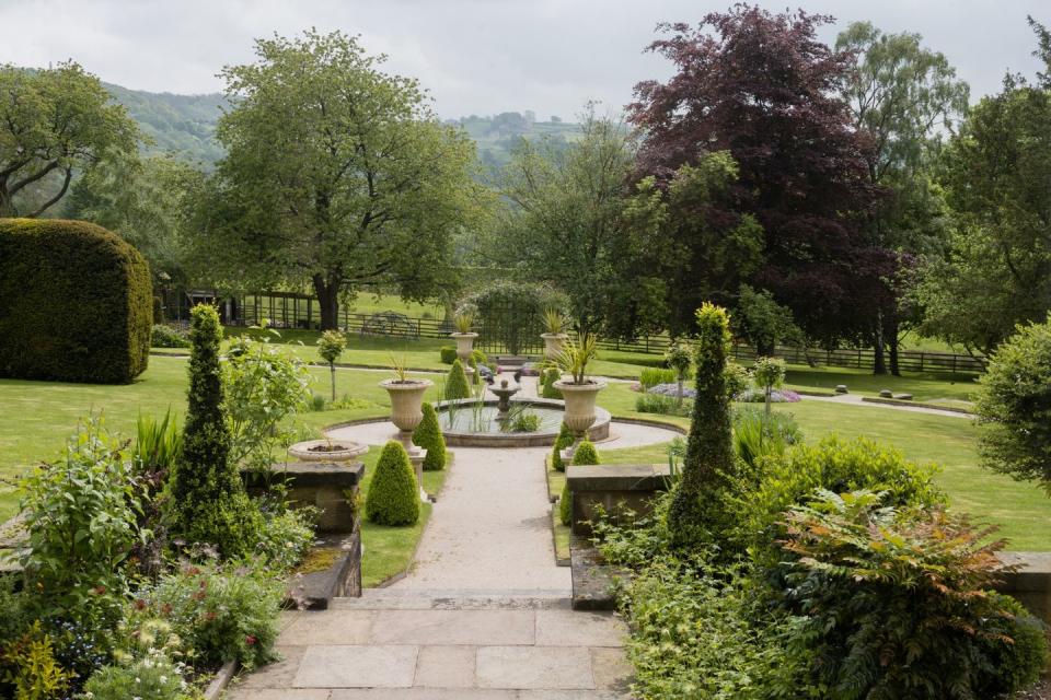 lea hurst sloped garden with a path