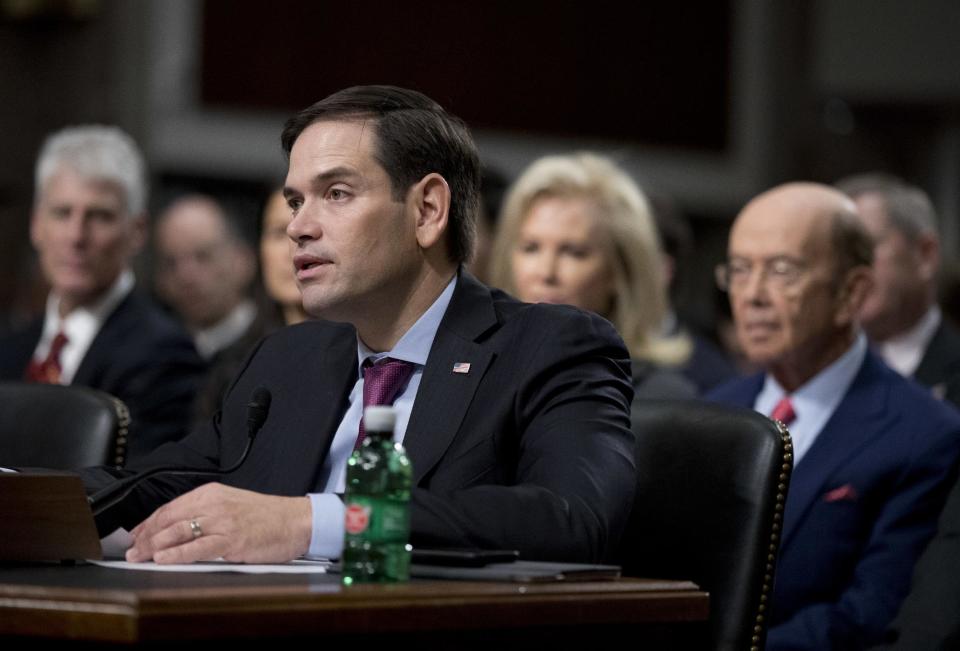 Sen. Marco Rubio, R-Fla., speaks in support to Commerce Secretary-designate Wilbur Ross, right, on Capitol Hill in Washington, Wednesday, Jan. 18, 2017, during Ross' confirmation hearing before the Senate Commerce Committee. (AP Photo/Manuel Balce Ceneta)