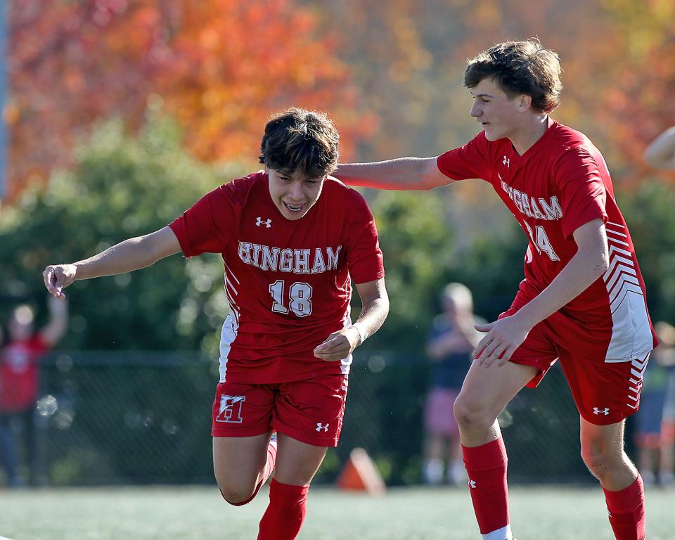 Hingham's Alessandro Neyra and Hingham’s Matthew McCarthy celebrate Alessandro’s goal that gave Hingham the 1-0 lead during first half action of their game at Hingham High School on Saturday, Oct. 28, 2023. Hingham would go on to win 3-0.