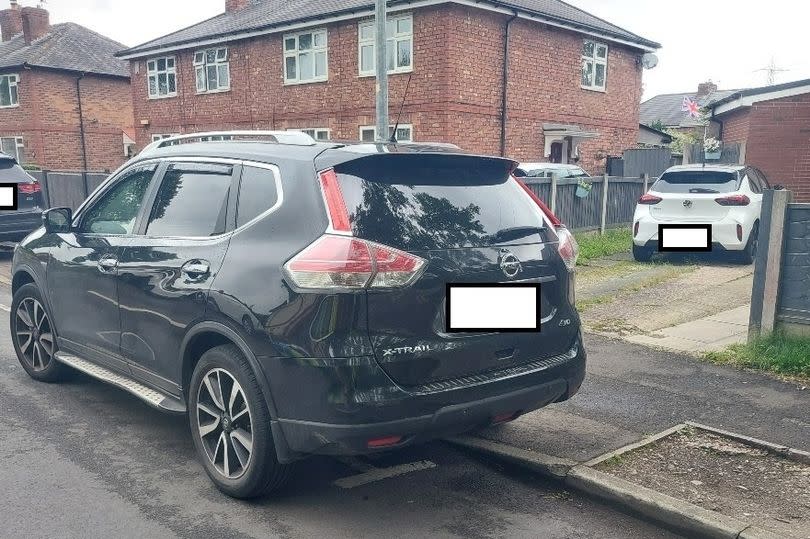 The resident woke to find a car over their driveway