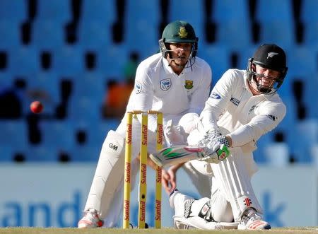 Cricket - New Zealand v South Africa - second cricket test match - Centurion Park, Centurion, South Africa - 30/8/2016. New Zealand's Henry Nicholls (R) plays a shot as South Africa's wicketkeeper Quinton de Kock looks on. REUTERS/Siphiwe Sibeko