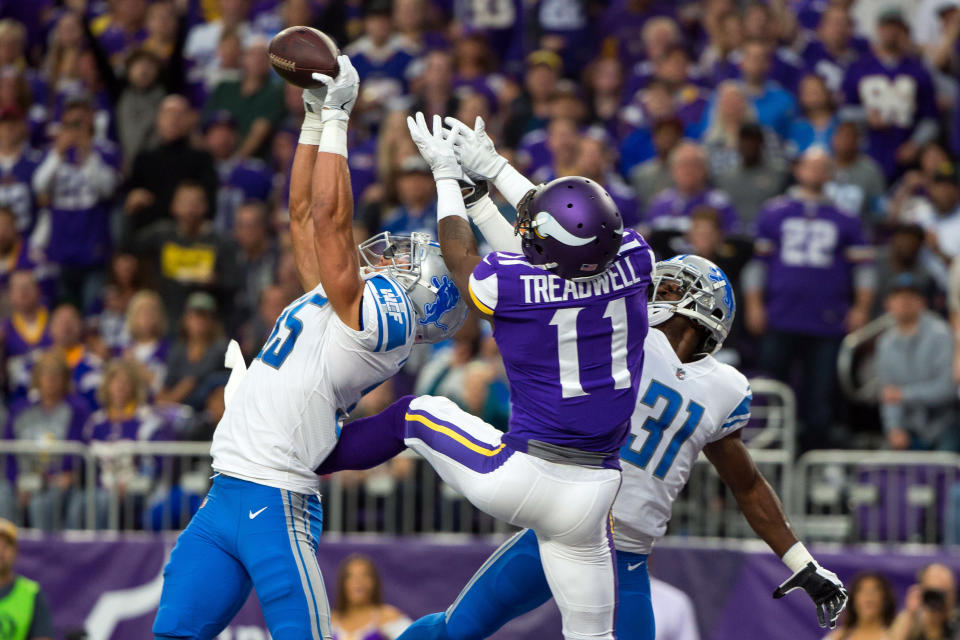 <p>Detroit Lions defensive back Miles Killebrew (35) breaks up a pass to Minnesota Vikings wide receiver Laquon Treadwell (11) in the second quarter at U.S. Bank Stadium. Mandatory Credit: Brad Rempel-USA TODAY Sports </p>