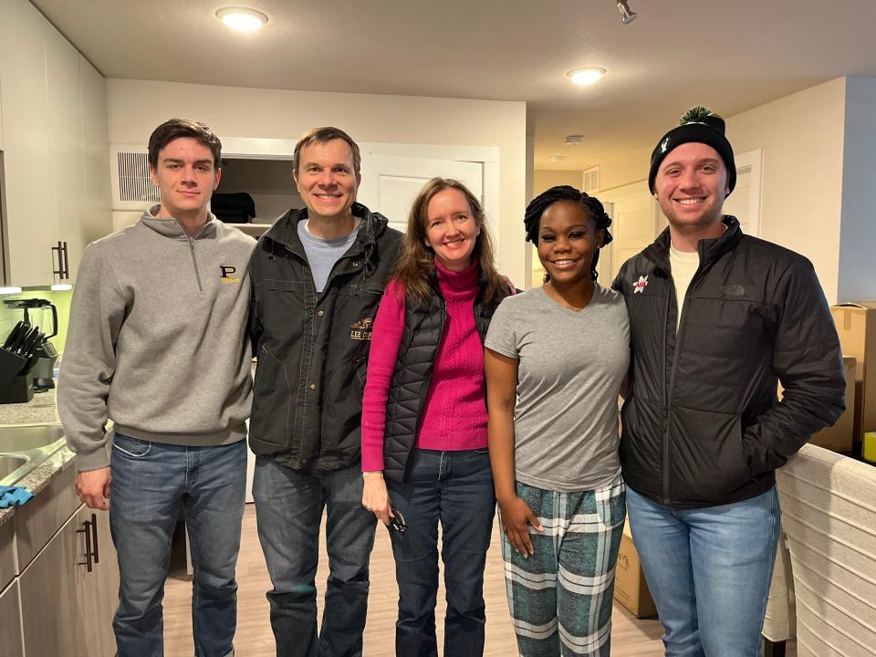 The Calabuigs, Simon, left, David, Rebekah and David Jr., brought many things to Naquisha Taylor, second from right, after they read her Season for Caring story in the American-Statesman. They finished her wish list.