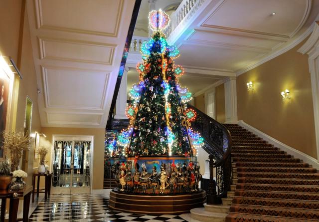 Louis Vuitton stacks travel trunks for Claridge's Christmas tree