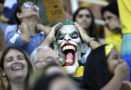 <p>A Brazil fan wearing a face mask reacts during women’s water polo preliminary round match against Italy at the 2016 Summer Olympics in Rio de Janeiro, Brazil, Tuesday, Aug. 9, 2016. (AP Photo/Sergei Grits) </p>