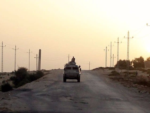 An Egyptian military vehicle is seen on the highway in northern Sinai, Egypt, in this May 25, 2015 file photo.   REUTERS/Asmaa Waguih/Files
