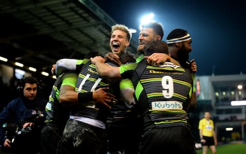 Northampton celebrate Ben Foden's try - Credit: Tony Marshall/Getty Images Europe