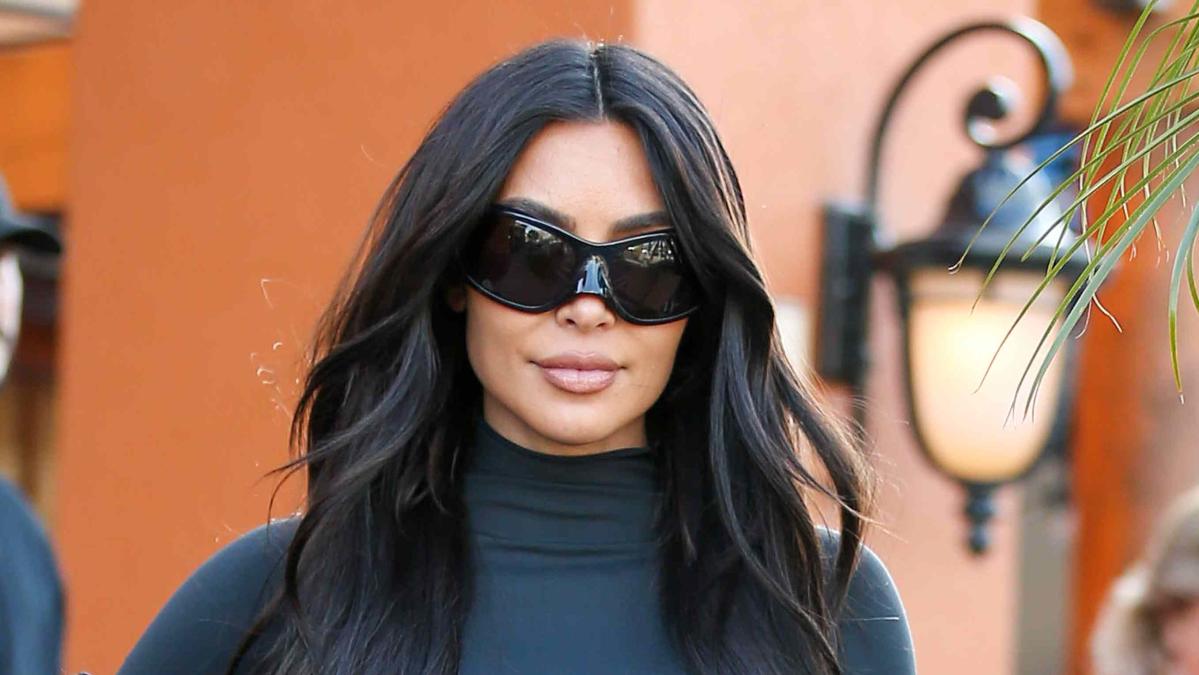 Kim Kardashian stuns in nude illusion stockings while sister