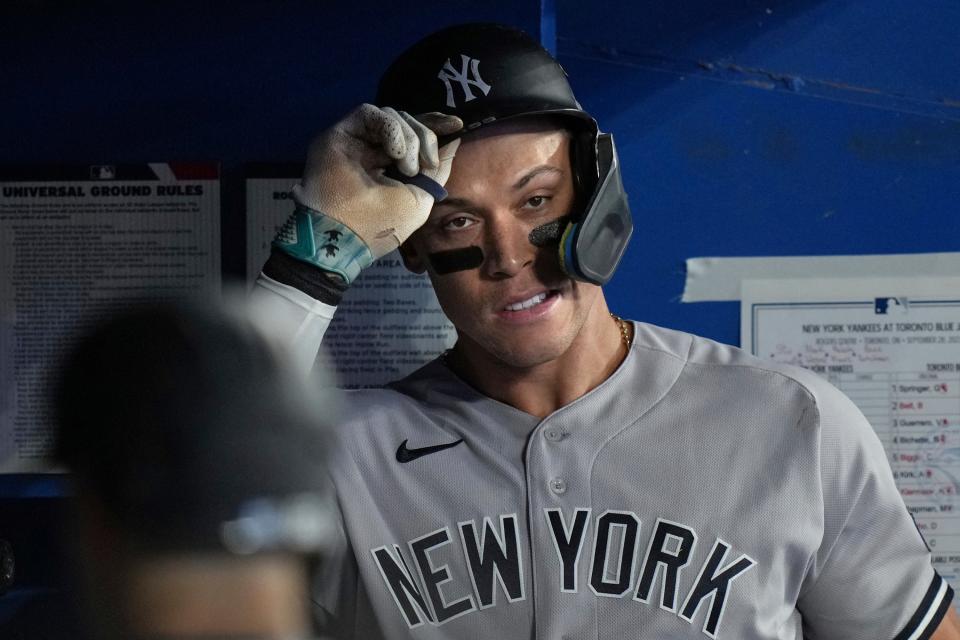 New York Yankees' Aaron Judge returns to the dugout after being struck out by Toronto Blue Jays starting pitcher Chris Bassitt during the eighth inning of Thursday, Sept. 28, 2023, in Toronto. (Chris Young/The Canadian Press via AP)