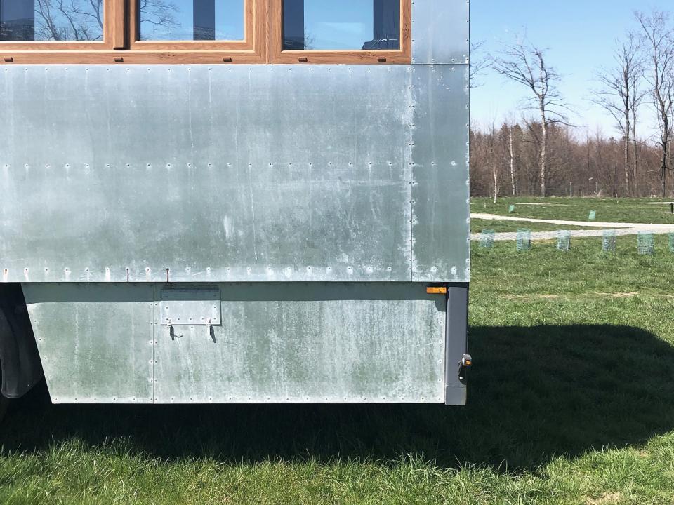 the rear of a Good Spot mobile hotel on a field