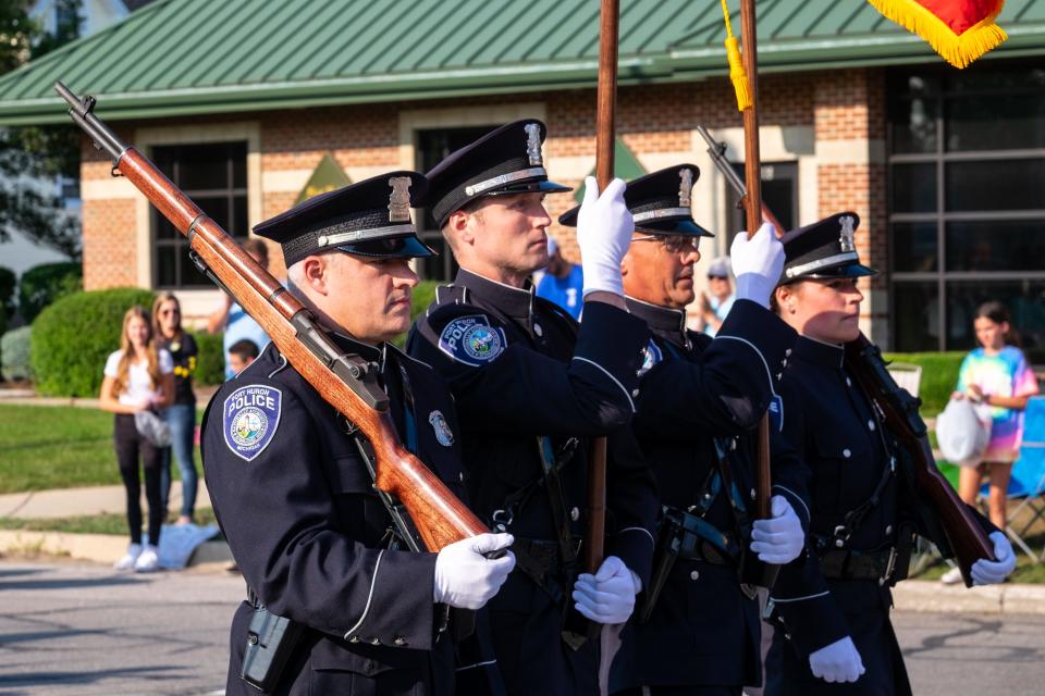 The Port Huron Police honor guard marches in the Rotary International  Day Parade during Boat Week Wednesday, July 21, 2021, in Port Huron.