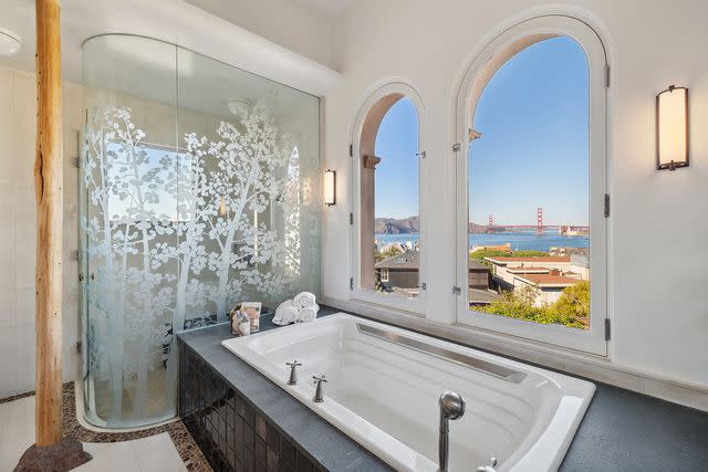 <p>Open Homes</p> The primary bathroom with views of the Golden Gate Bridge.