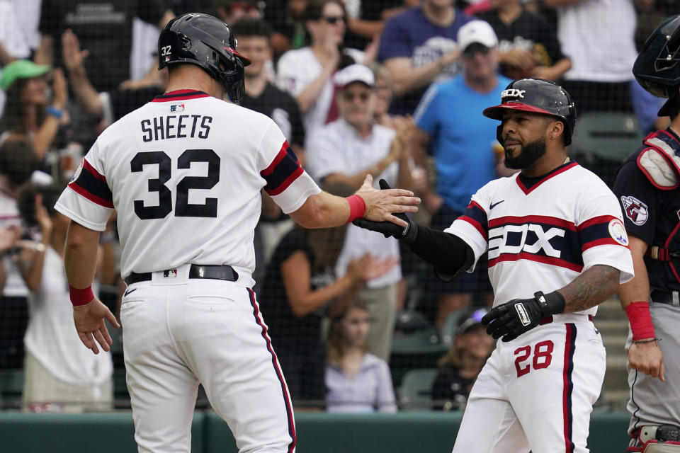 Chicago White Sox's Leury Garcia, right, celebrates with Gavin Sheets after hitting a two-run home run during the second inning of a baseball game in Chicago, Sunday, July 24, 2022. (AP Photo/Nam Y. Huh)