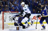 May 23, 2016; St. Louis, MO, USA; San Jose Sharks center Logan Couture (39) attempts to deflect a shot in front of St. Louis Blues goalie Jake Allen (34) during the second period in game five of the Western Conference Final of the 2016 Stanley Cup Playoffs at Scottrade Center. Mandatory Credit: Billy Hurst-USA TODAY Sports