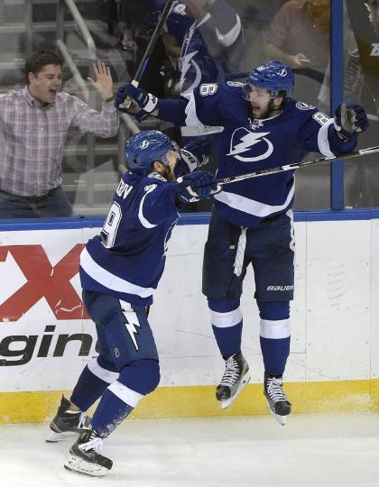 Nikita Kucherov jumps for joy after scoring the overtime winner for Tampa Bay in a wild Game 3. (AP)