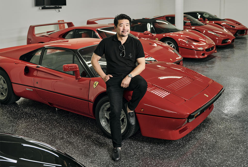 David Lee poses for a portrait next to his 1985 Ferrari 288 GTO in his garage. 