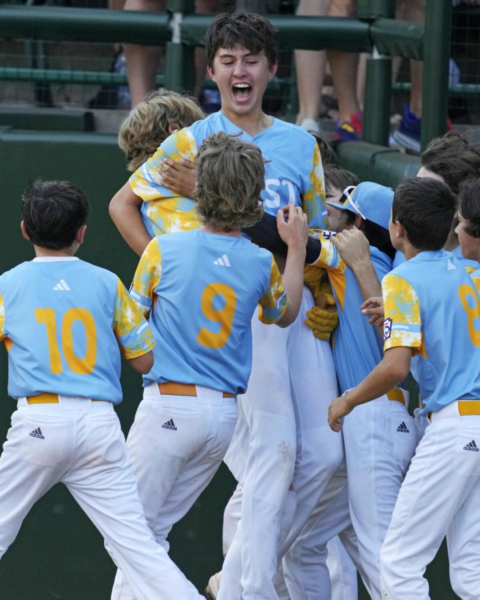 Louis Lappe celebrates with his teammates after his walk-off home run Sunday.