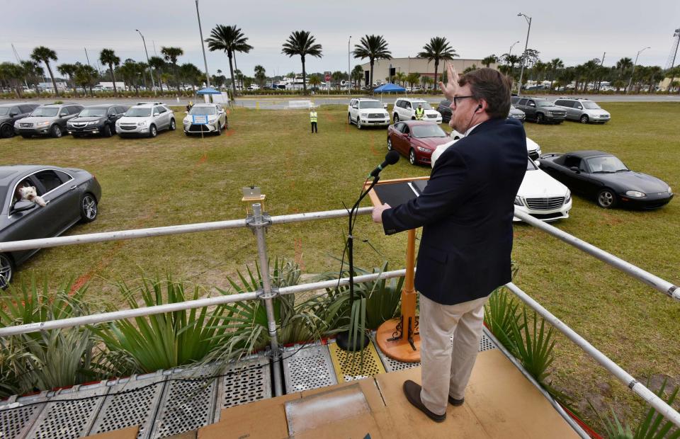 The lockdown prompted by the COVID-19 pandemic left many pastors nationwide stressed and scrambling to find ways to conduct services and maintain community without gathering in close quarters. In Jacksonville Beach, Fla., senior pastor David Ball of the Church of Our Savior delivered a Palm Sunday sermon during a drive-in church service in April 2020.