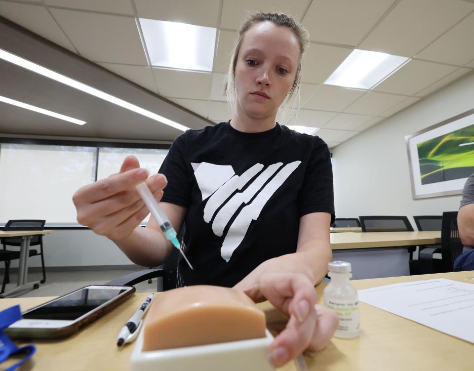 Ashland Davis, With Volunteers of America, practices a naloxone injection during Utah Naloxone training for opioid overdose in Salt Lake City on Tuesday, May 23, 2023. | Jeffrey D. Allred, Deseret News