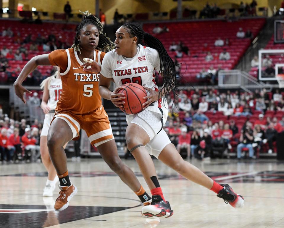 Texas' forward DeYona Gaston (5), left, guards Texas Tech's guard Bre'Amber Scott (23) in a Big 12 women's basketball game, Wednesday, Jan. 18, 2023, at United Supermarkets Arena.