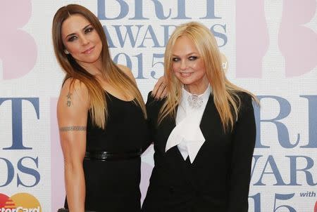 Former Spice Girls Melanie Chisholm (Sporty Spice) and Emma Bunton (Baby Spice) arrive for the BRIT music awards at the O2 Arena in Greenwich, London, February 25, 2015. REUTERS/Suzanne Plunkett/Files