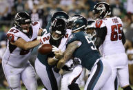 Atlanta Falcons' Matt Ryan (2) fumbles the ball after a hit from Philadelphia Eagles' Chris Long (56) during the second half of an NFL football game, Thursday, Sept. 6, 2018, in Philadelphia. The Falcons recovered the fumble. (AP Photo/Michael Perez)