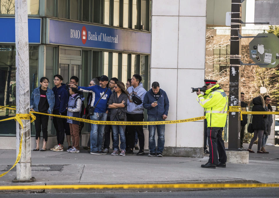 <p>Emergency services close Yonge Street in Toronto after a van mounted a sidewalk crashing into a number of pedestrians on Monday, April 23, 2018. (Photo: Aaron Vincent Elkaim/Canadian Press) </p>