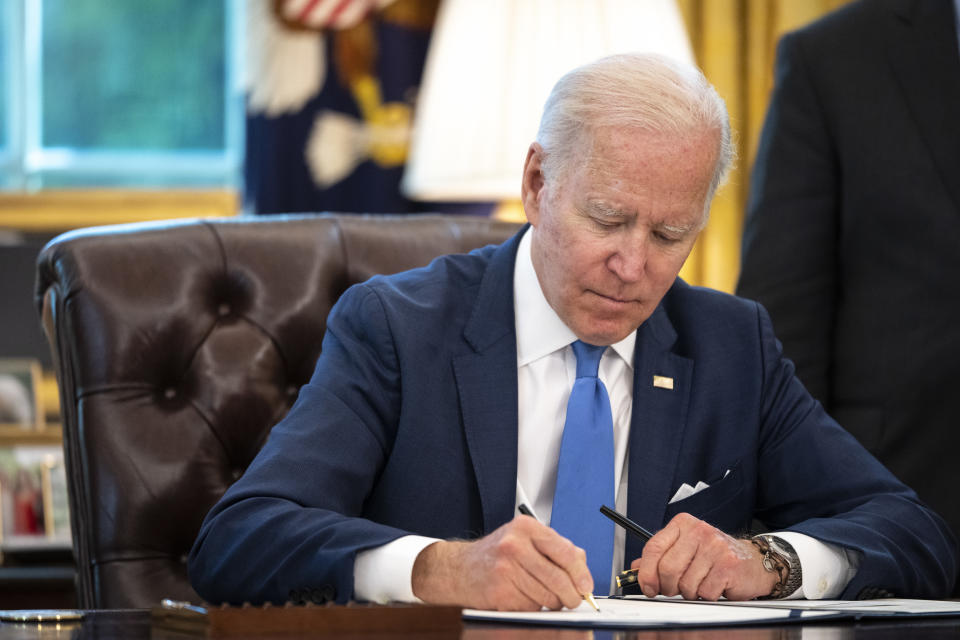 WASHINGTON, DC - MAY 9: U.S. President Joe Biden signs the Ukraine Democracy Defense Lend-Lease Act of 2022 in the Oval Office of the White House May 9, 2022 in Washington, DC. The Ukraine Democracy Defense Lend-Lease Act of 2022 was unanimously passed by the U.S. Senate on April 7 and will expedite military aide and other resources to Ukraine. (Photo by Drew Angerer/Getty Images)