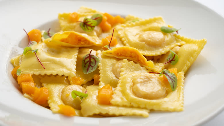 pumpkin ravioli on white plate 