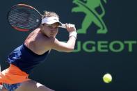 Mar 29, 2017; Miami, FL, USA; Simona Halep of Romania hits a backhand against Johanna Konta of Great Britain (not pictured) on day nine of the 2017 Miami Open at Crandon Park Tennis Center. Geoff Burke-USA TODAY Sports