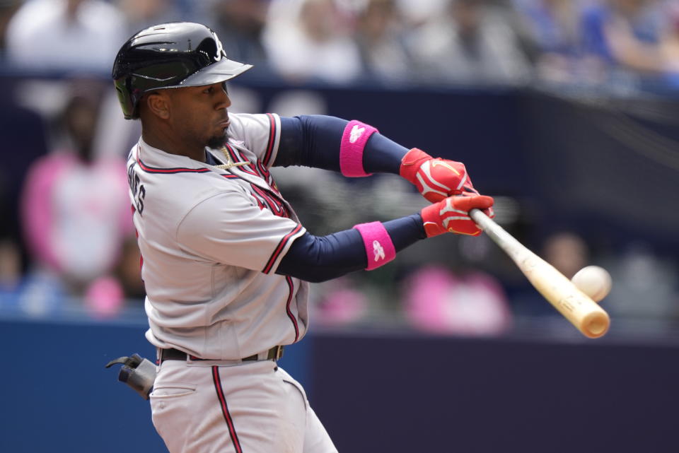 Atlanta Braves' Ozzie Albies connects for a two-run home run against the Toronto Blue during the third inning of a baseball game in Toronto, on Sunday, May 14, 2023. (Frank Gunn/The Canadian Press via AP)